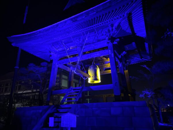 Zenkoji's bell house illuminated in blue at Zenkoji Lantern Festival